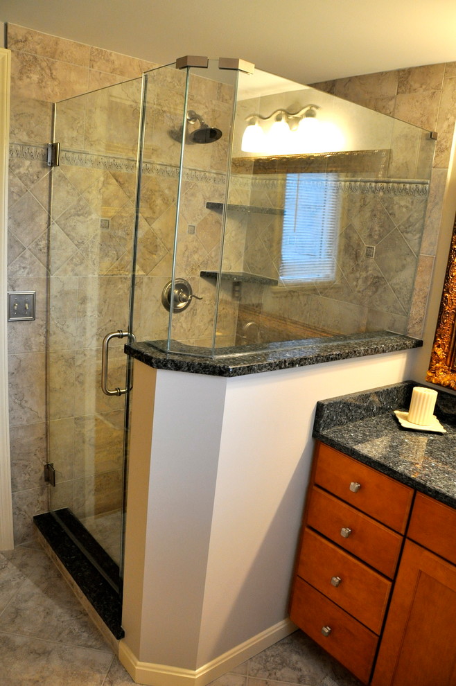Inspiration for a small transitional kids' gray tile and porcelain tile porcelain tile alcove bathtub remodel in Cincinnati with gray walls, an undermount sink, granite countertops, furniture-like cabinets, dark wood cabinets and a two-piece toilet