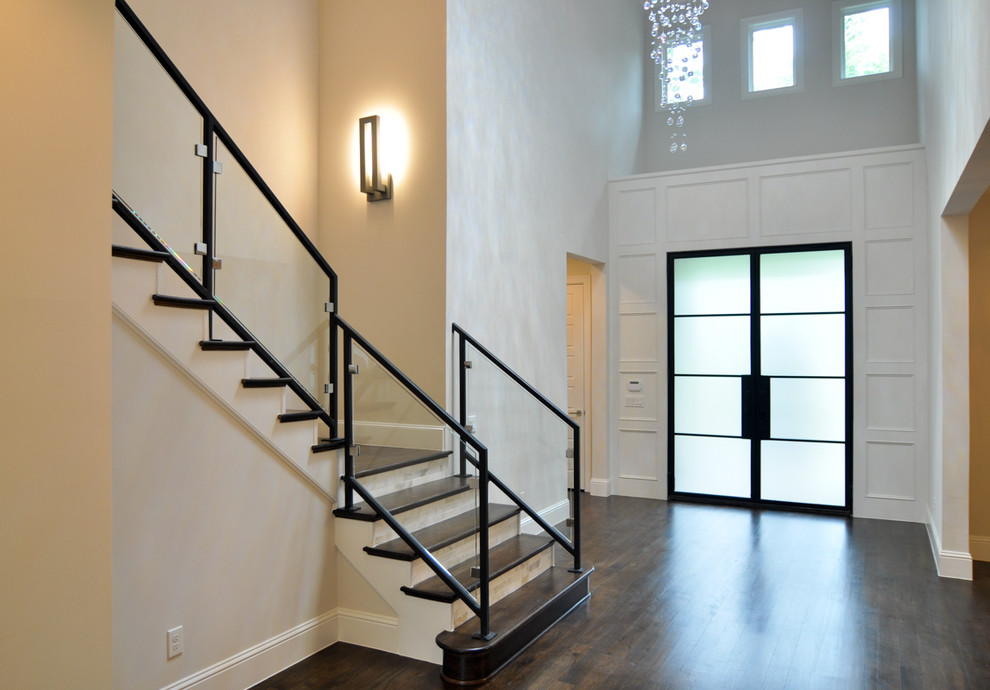 Large transitional wood l-shaped staircase in Dallas with tile risers.