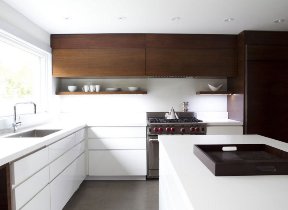 Large modern galley open plan kitchen in Melbourne with an undermount sink, flat-panel cabinets, medium wood cabinets, marble benchtops, stone slab splashback, stainless steel appliances, ceramic floors and with island.