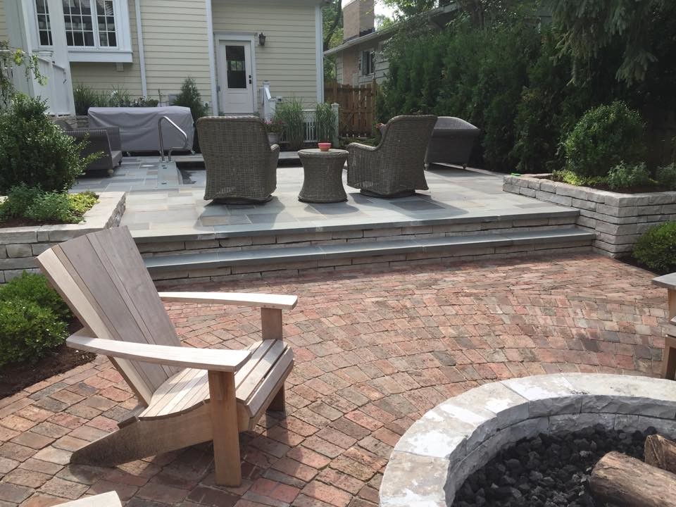 Large traditional backyard patio in Chicago with tile and no cover.
