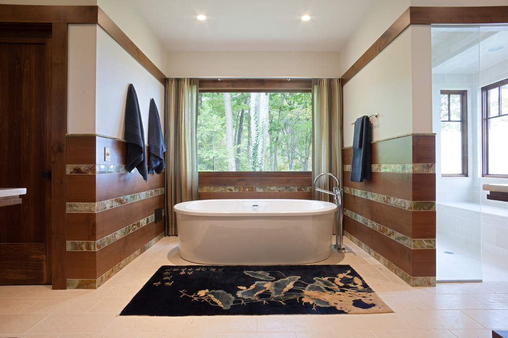 Design ideas for a large transitional master bathroom in Chicago with a freestanding tub, an undermount sink, flat-panel cabinets, dark wood cabinets, an open shower, a one-piece toilet, multi-coloured tile, stone tile, white walls and limestone floors.