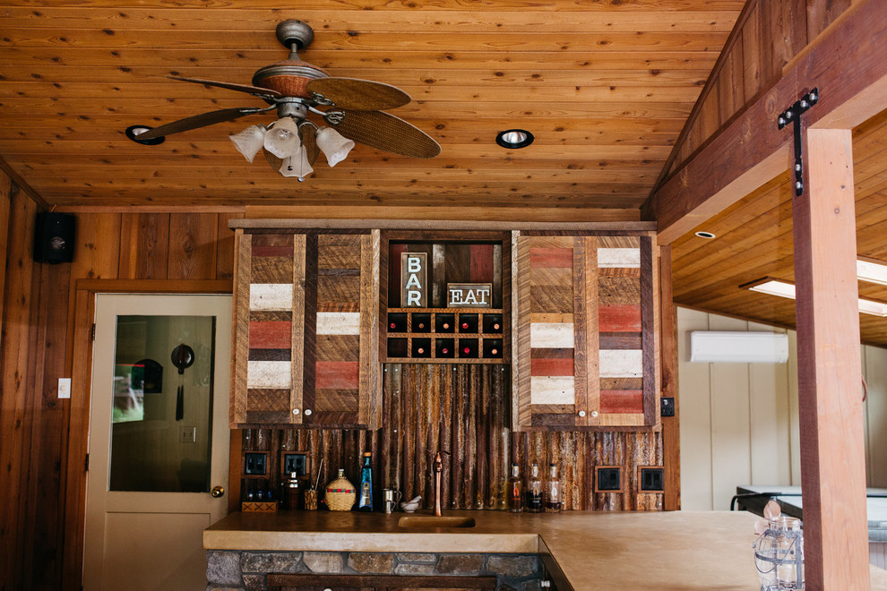 Inspiration for a mid-sized rustic l-shaped ceramic tile and brown floor eat-in kitchen remodel with shaker cabinets, medium tone wood cabinets, brown backsplash, wood backsplash, a peninsula and an integrated sink