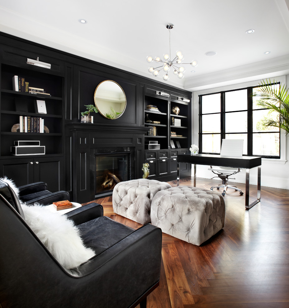 Design ideas for a transitional home office in Toronto with dark hardwood floors, a freestanding desk, black walls and brown floor.