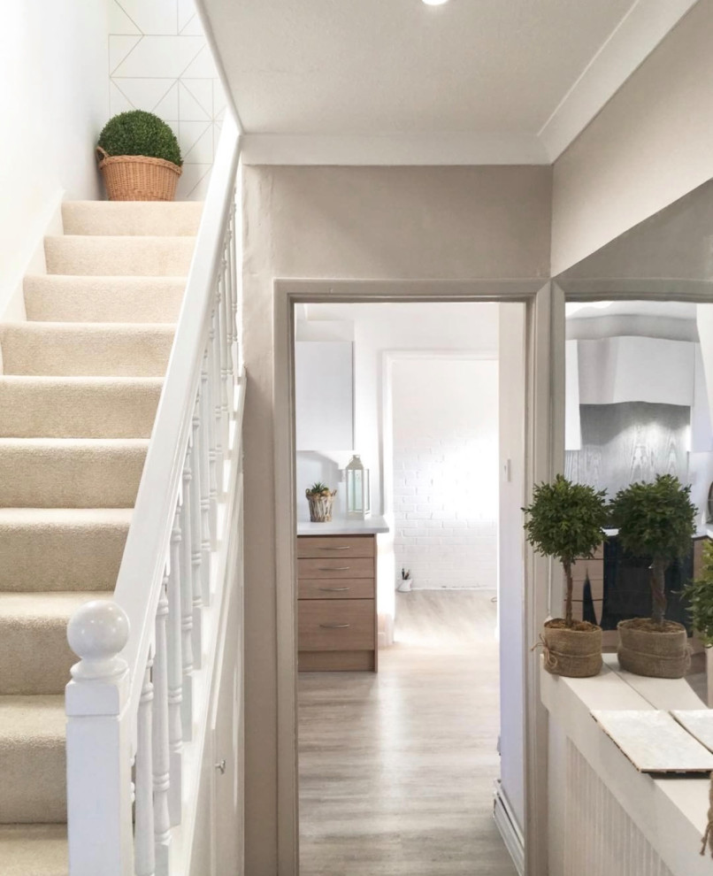 Small entry hall in Cardiff with grey walls, vinyl floors, a single front door, a white front door and grey floor.