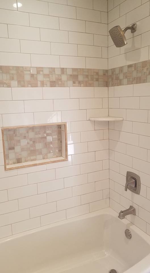 Mid-sized transitional 3/4 white tile and subway tile mosaic tile floor and white floor alcove bathtub photo with shaker cabinets, white cabinets, a two-piece toilet, beige walls, an undermount sink, solid surface countertops and white countertops