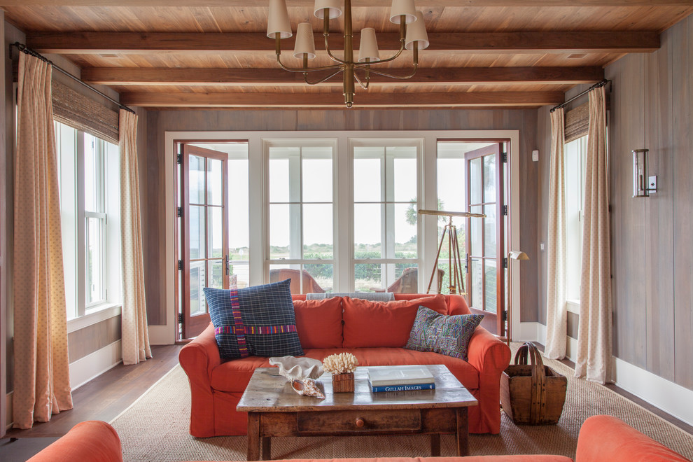 Photo of a beach style family room in Charleston with medium hardwood floors.