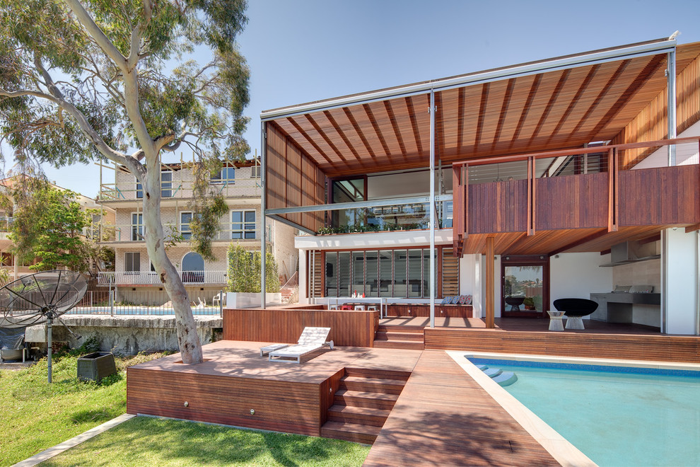 Design ideas for a contemporary exterior in Sydney with wood siding.