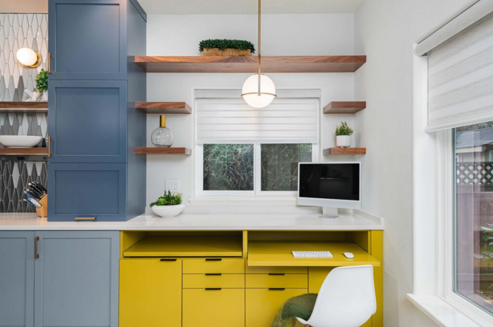 Example of a transitional galley vinyl floor and gray floor kitchen design with an undermount sink, shaker cabinets, blue cabinets, quartz countertops, multicolored backsplash, ceramic backsplash, stainless steel appliances, a peninsula and white countertops