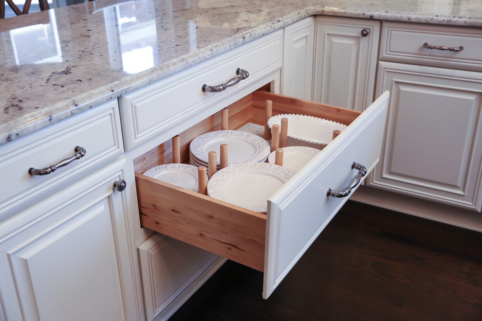 Inspiration for a large transitional u-shaped dark wood floor kitchen remodel in Chicago with a double-bowl sink, raised-panel cabinets, white cabinets, granite countertops, gray backsplash, subway tile backsplash, stainless steel appliances and an island