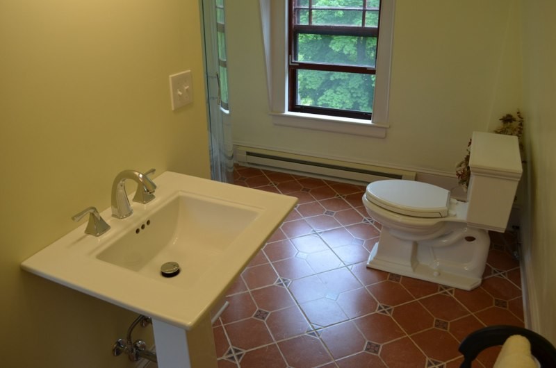 Bathroom - mid-sized orange tile bathroom idea in Portland Maine with a drop-in sink and white walls