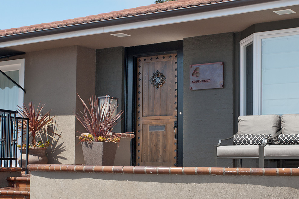 Example of a mountain style home design design in Orange County
