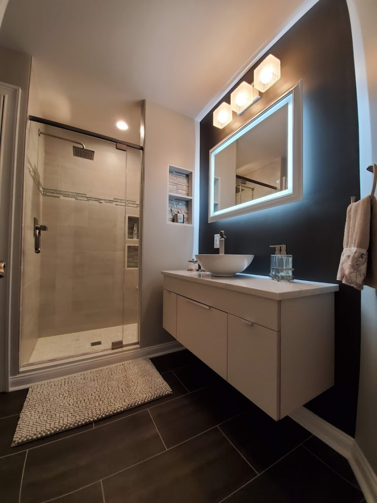Photo of a mid-sized contemporary 3/4 bathroom in Philadelphia with flat-panel cabinets, white cabinets, an alcove shower, black walls, porcelain floors, a vessel sink, engineered quartz benchtops, grey floor, a hinged shower door, grey benchtops, a niche, a single vanity and a floating vanity.