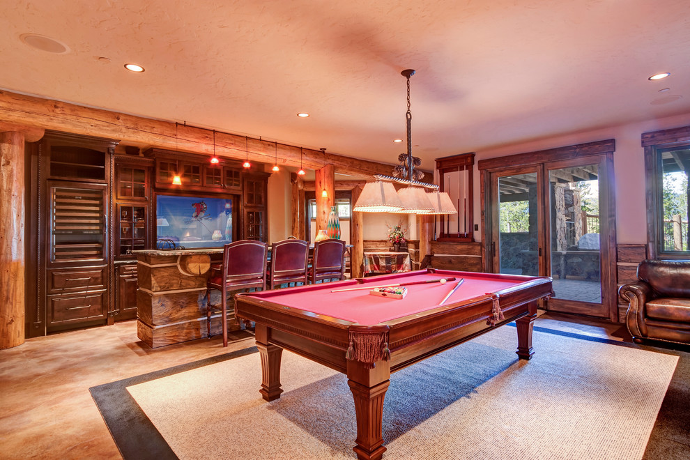 Large mountain style walk-out beige floor basement photo with beige walls