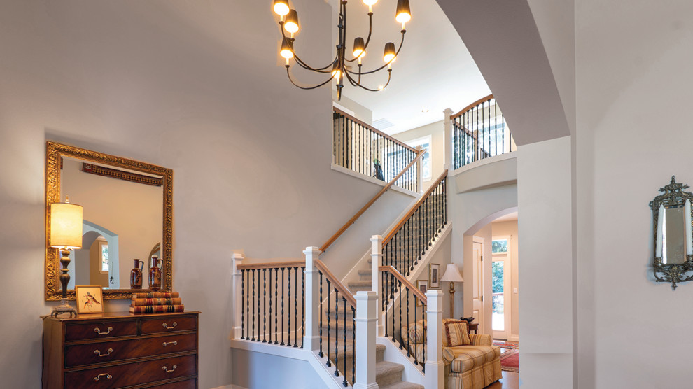 Example of a mid-sized transitional ceramic tile and white floor foyer design in Seattle with beige walls and a dark wood front door