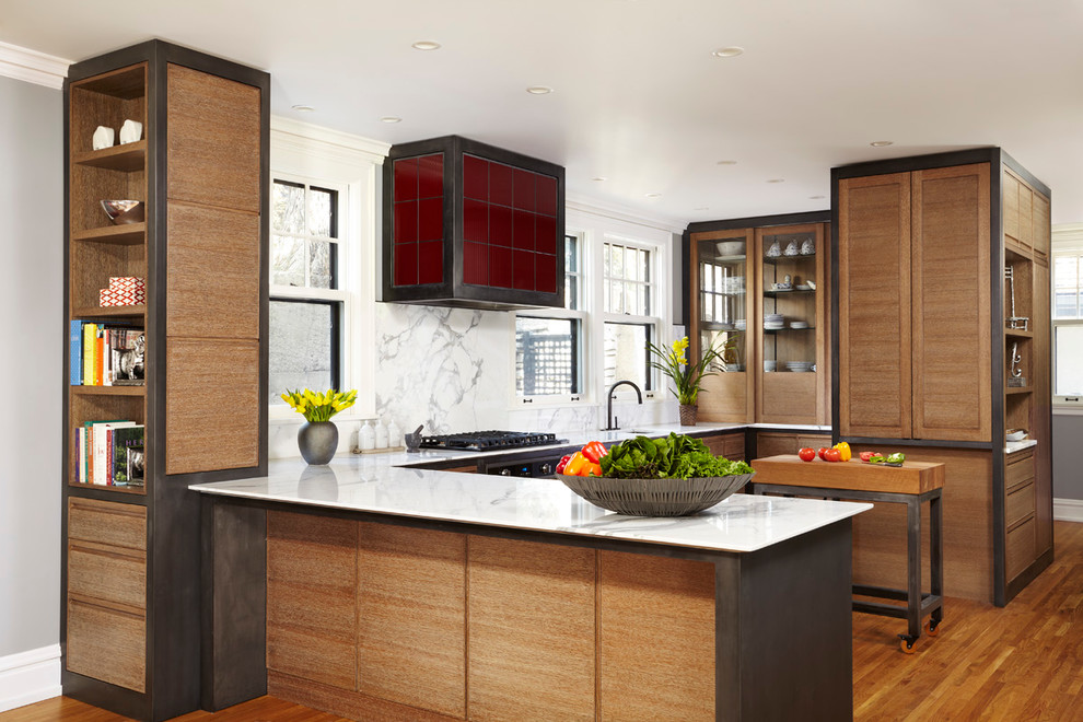 Inspiration for a transitional u-shaped kitchen in Minneapolis with flat-panel cabinets, medium wood cabinets, white splashback, medium hardwood floors and an undermount sink.