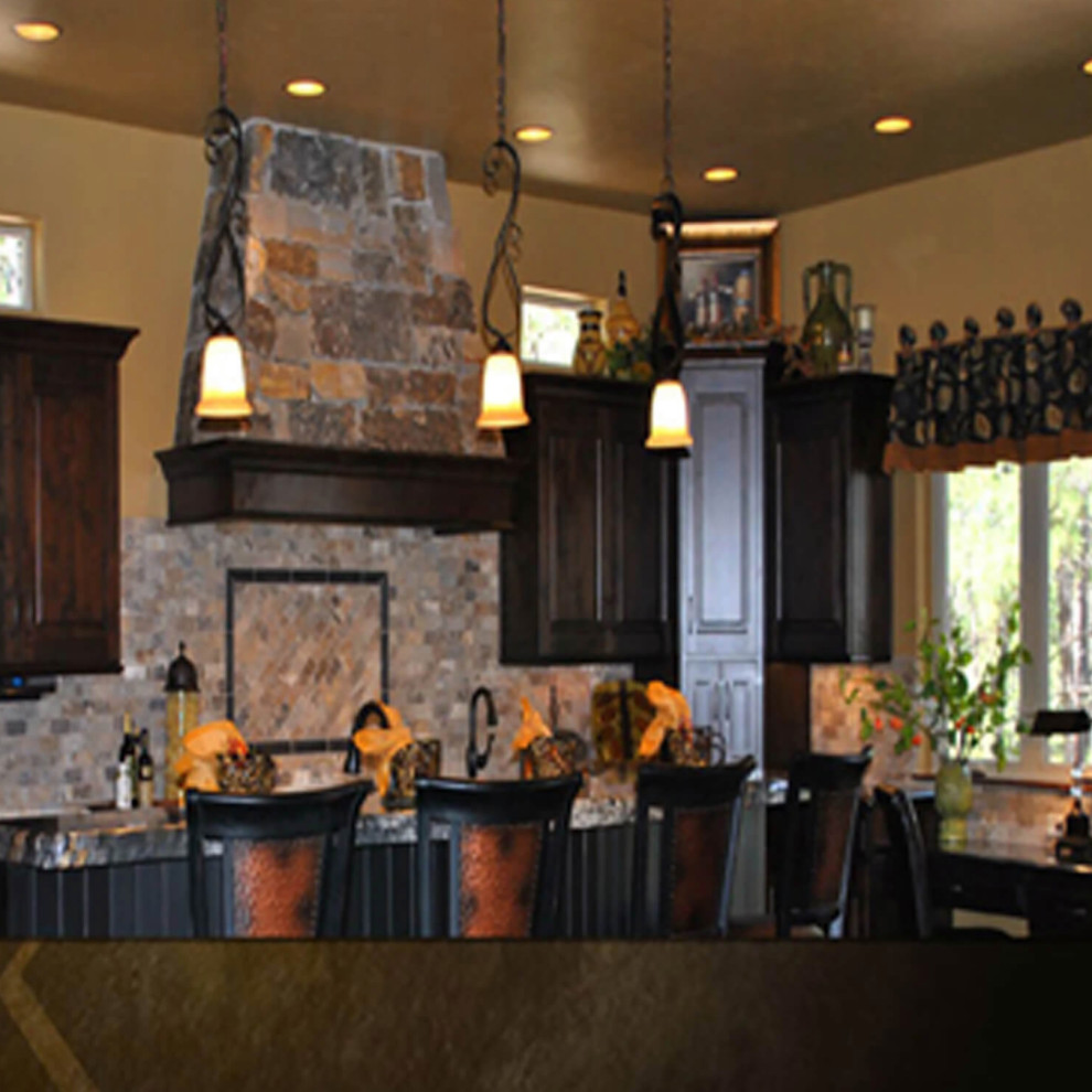 Example of a mountain style home design design in Denver