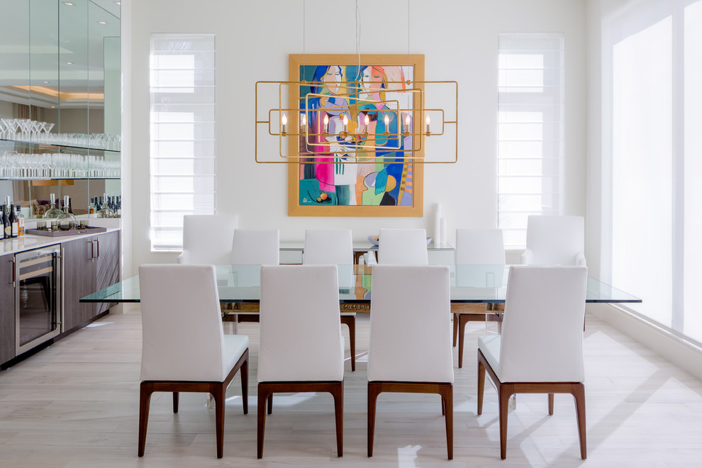 Design ideas for a contemporary separate dining room in Miami with white walls, no fireplace and light hardwood floors.