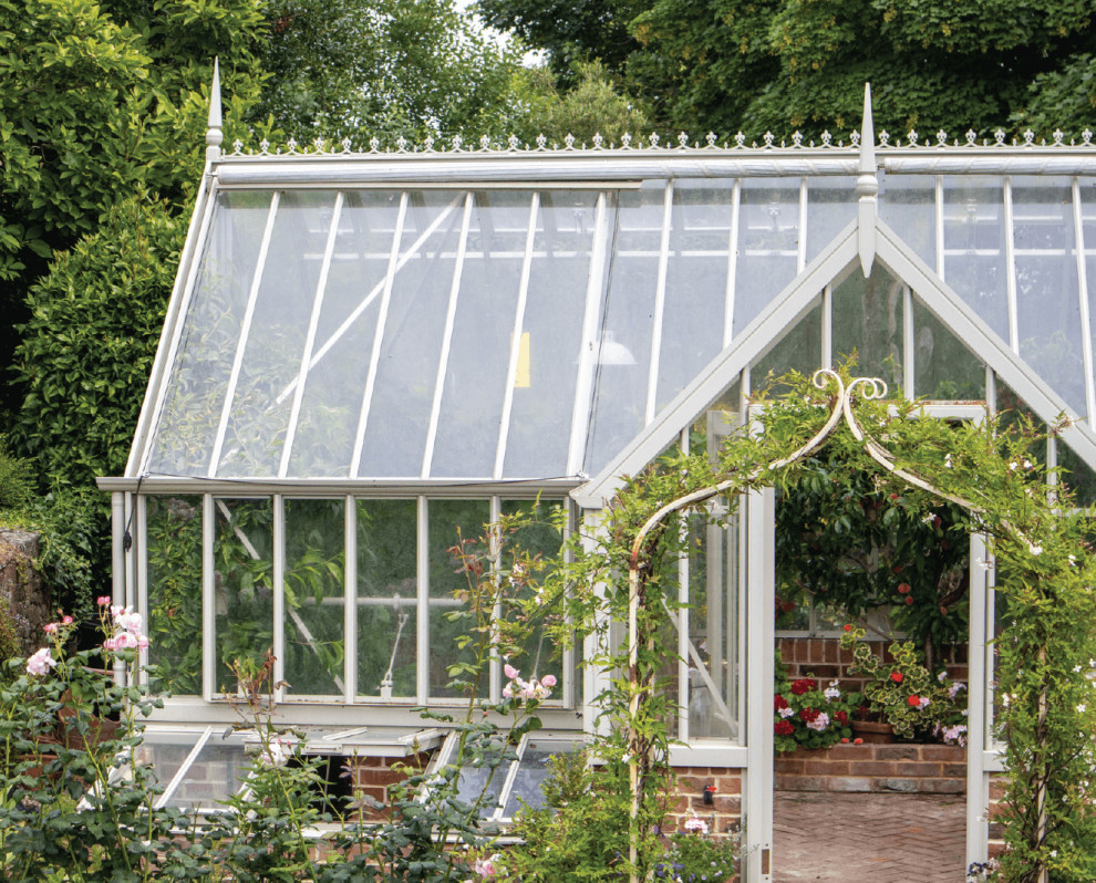 This is an example of a mid-sized traditional detached greenhouse in Other.