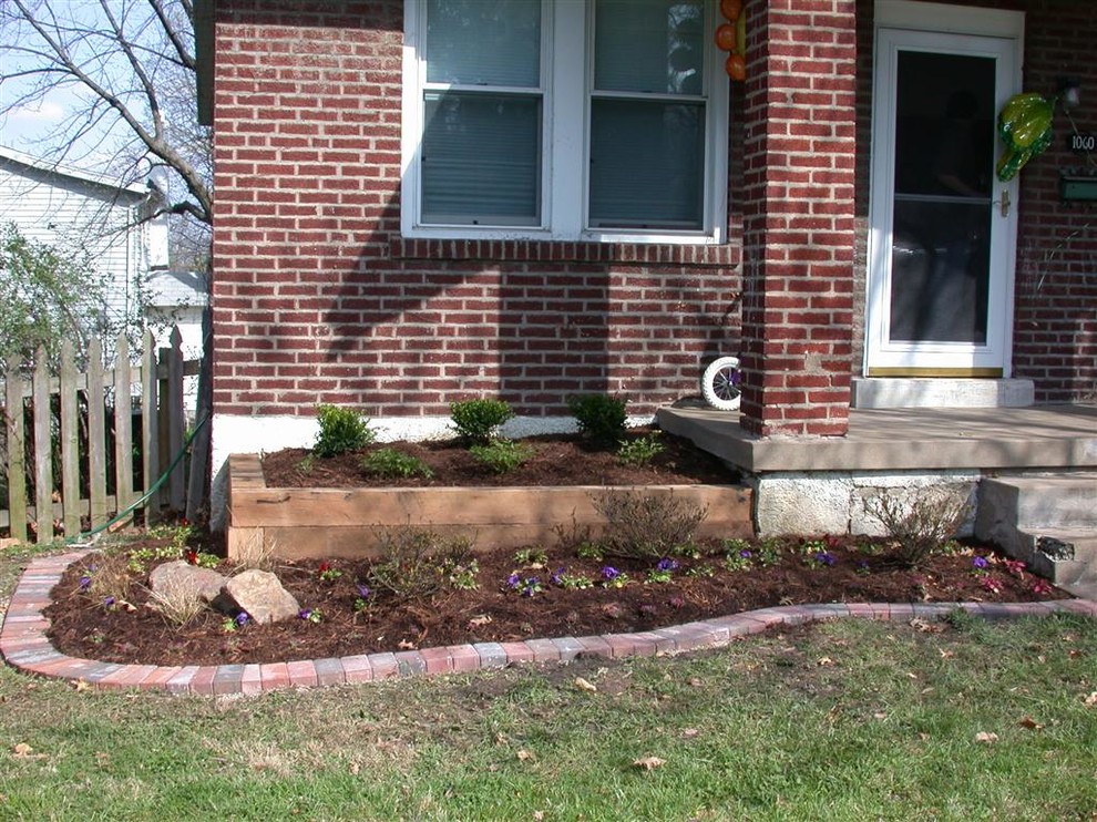 This is an example of a traditional side yard driveway in St Louis with natural stone pavers.