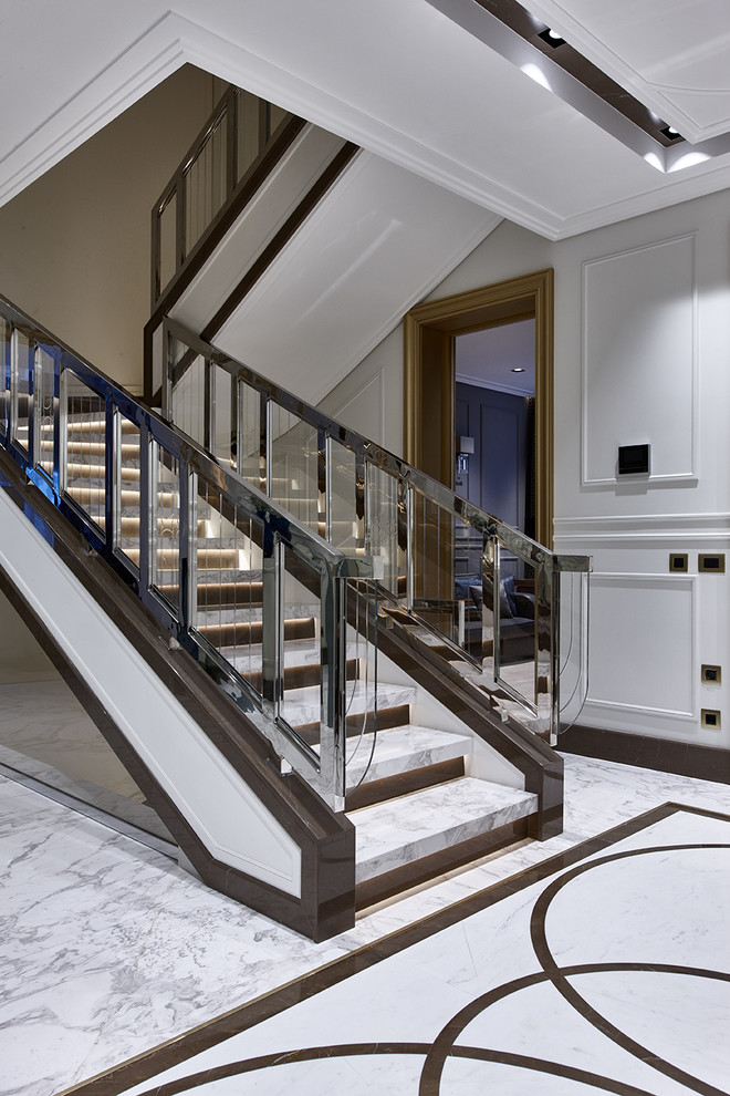 Design ideas for a transitional marble u-shaped staircase in Moscow with mixed railing.