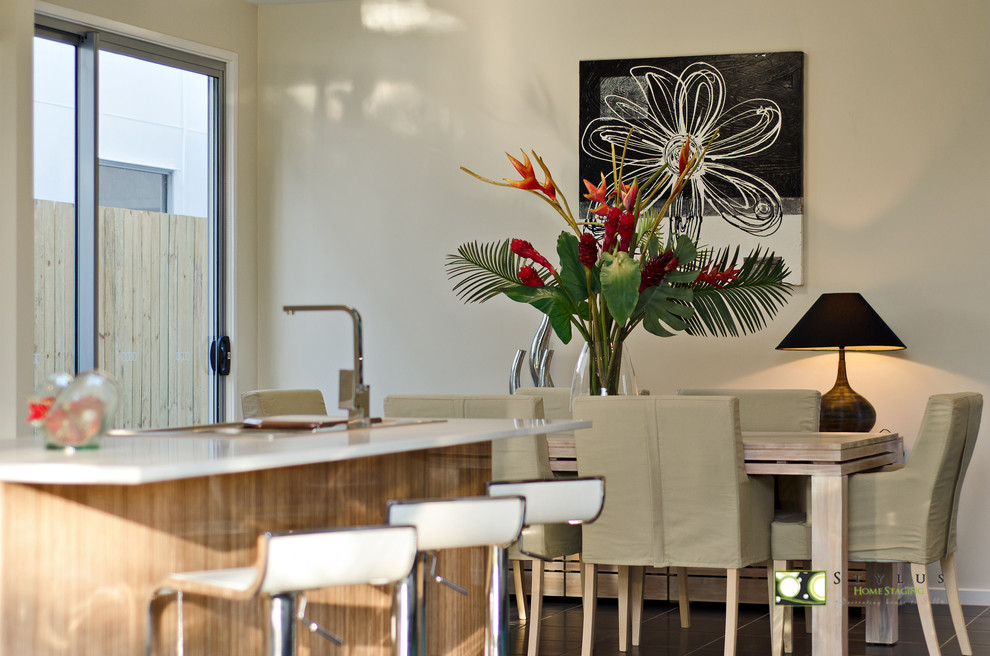 This is an example of a mid-sized contemporary dining room in Brisbane with terra-cotta floors.