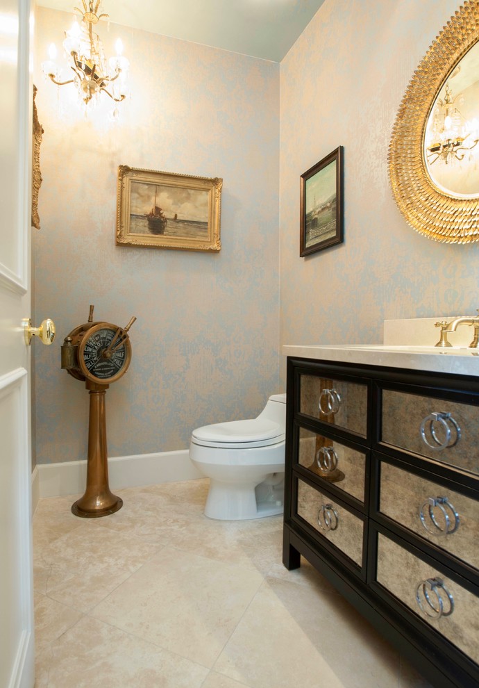 This is an example of a mid-sized traditional powder room in Los Angeles with shaker cabinets, black cabinets, a one-piece toilet, engineered quartz benchtops, multi-coloured walls, travertine floors, an undermount sink and beige floor.