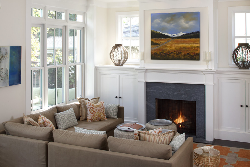Photo of a mid-sized traditional living room in San Francisco with beige walls, a standard fireplace and no tv.