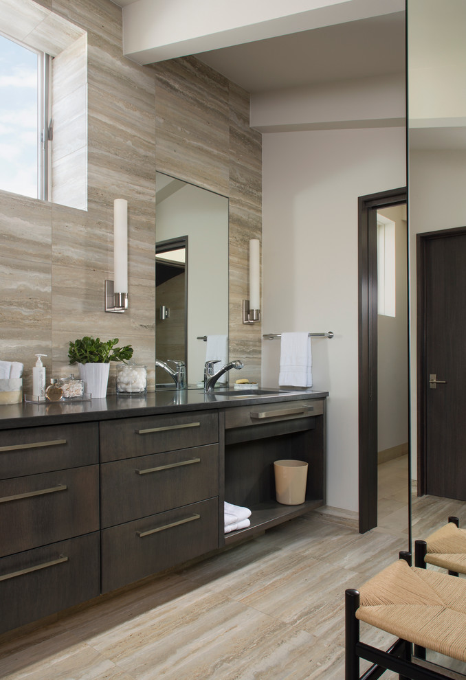 Inspiration for a contemporary bathroom in Denver with an undermount sink, flat-panel cabinets, dark wood cabinets, beige tile and beige floor.