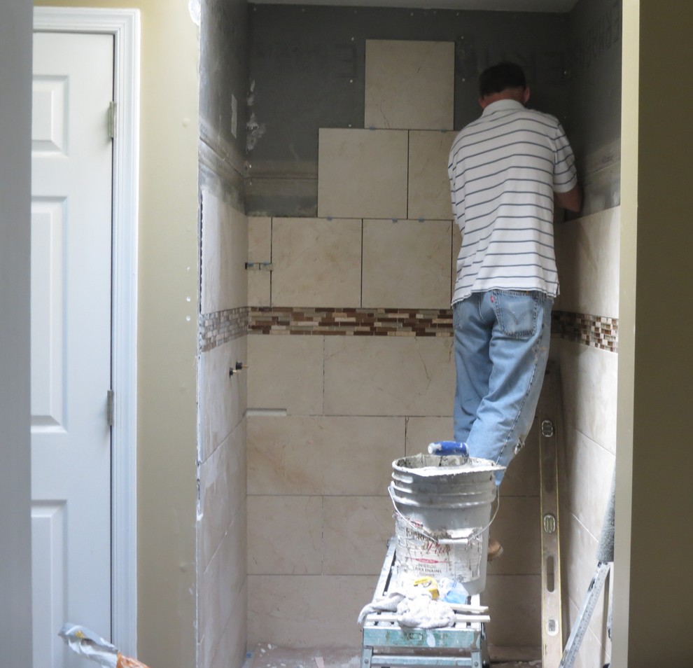 Mid-sized transitional master beige tile and porcelain tile dark wood floor bathroom photo with shaker cabinets, dark wood cabinets, beige walls, granite countertops and an undermount sink