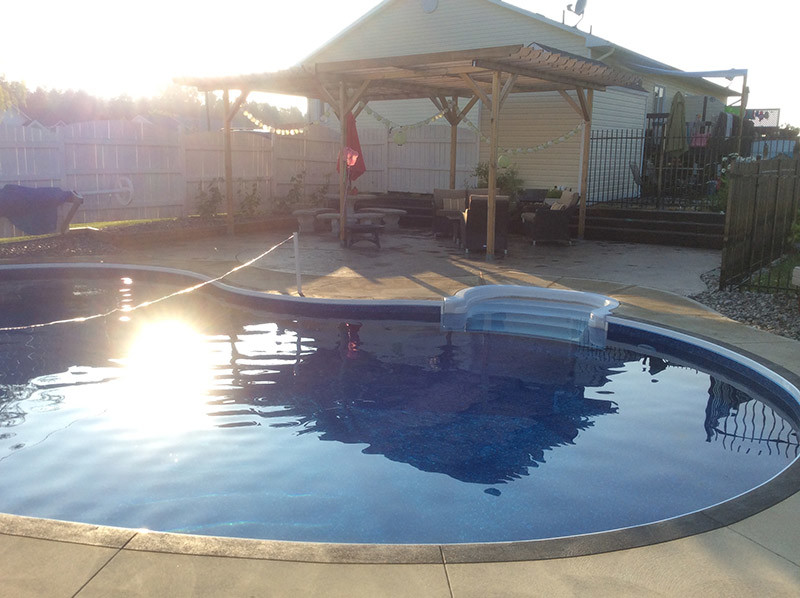 Pool - large traditional backyard stone and custom-shaped natural pool idea