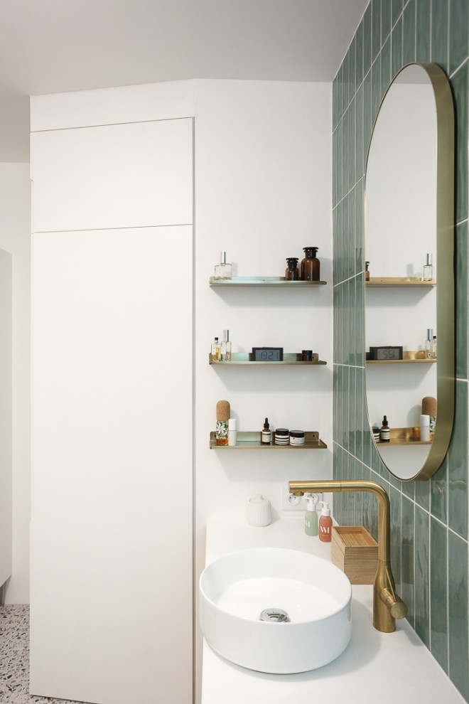 Photo of a medium sized contemporary ensuite bathroom in Paris with beaded cabinets, light wood cabinets, a freestanding bath, a shower/bath combination, green tiles, terracotta tiles, white walls, terrazzo flooring, a vessel sink, quartz worktops, multi-coloured floors, a hinged door, white worktops, a laundry area, double sinks and a floating vanity unit.