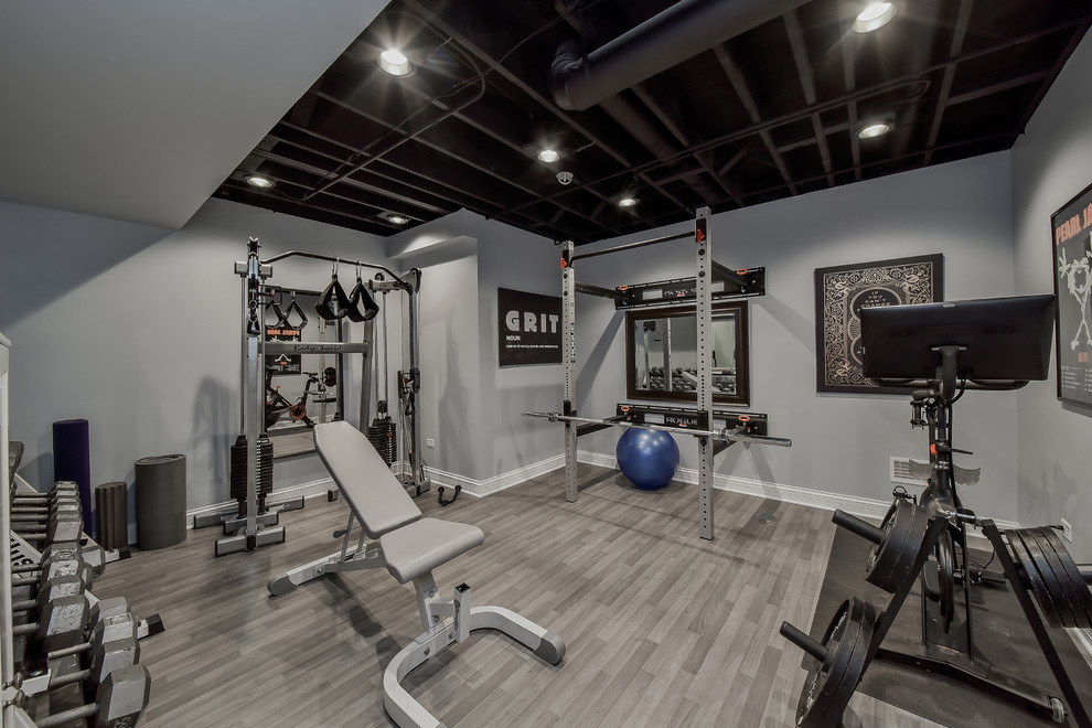 Transitional home gym in Nashville with grey walls and grey floor.