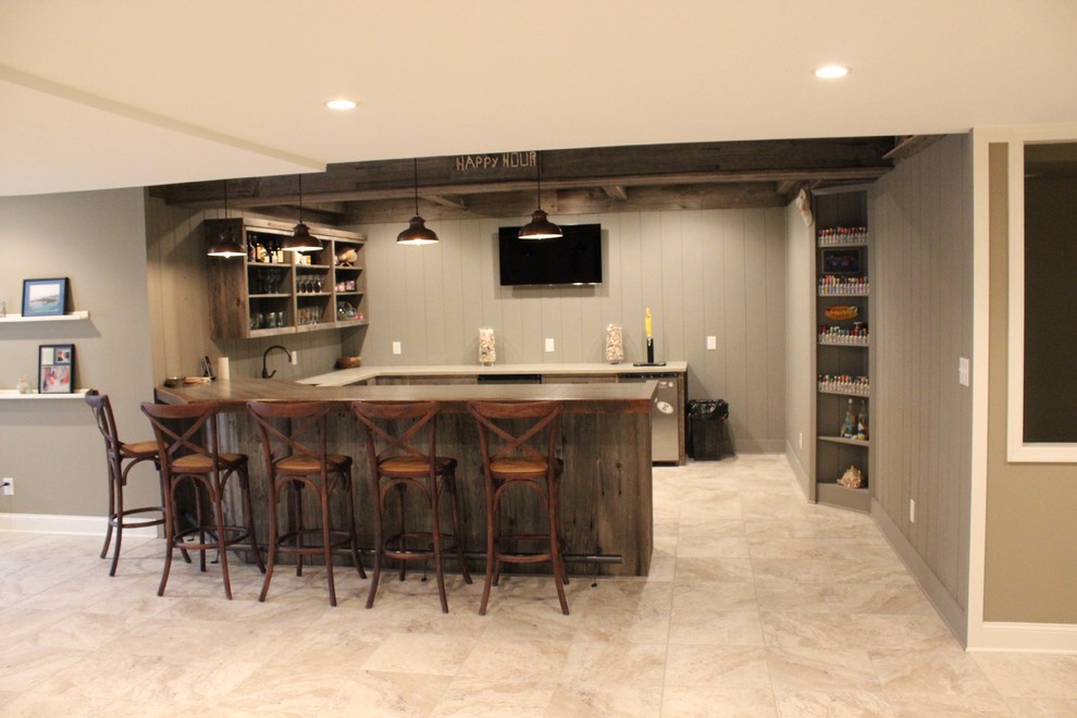 Photo of a mid-sized country u-shaped seated home bar in Philadelphia with an undermount sink, open cabinets, distressed cabinets, wood benchtops, grey splashback, timber splashback, ceramic floors and beige floor.