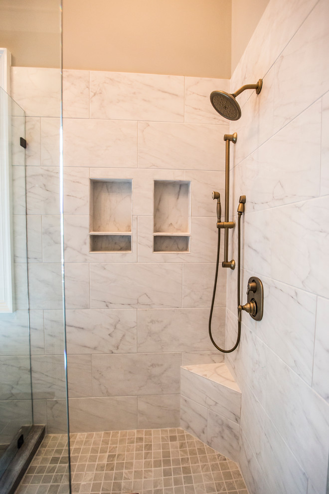Design ideas for a large transitional master bathroom in Atlanta with an undermount sink, raised-panel cabinets, beige cabinets, granite benchtops, a freestanding tub, gray tile, porcelain tile, grey walls and porcelain floors.