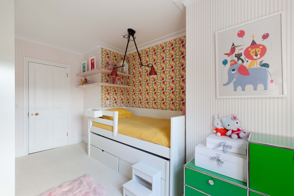 Design ideas for a mid-sized modern kids' bedroom for kids 4-10 years old and girls in London with pink walls, carpet and white floor.