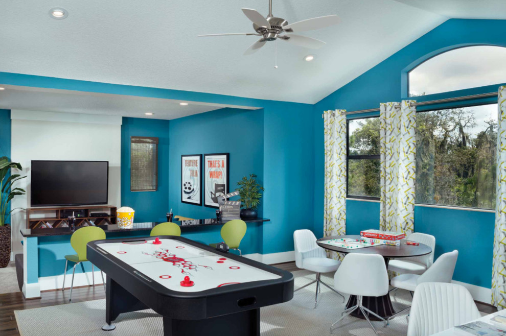 Inspiration for a transitional gender-neutral kids' playroom in Tampa with blue walls.