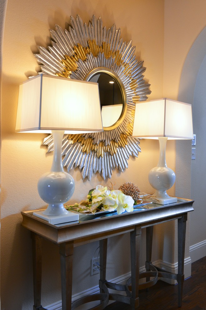 Inspiration for a mid-sized transitional medium tone wood floor foyer remodel in Dallas with beige walls