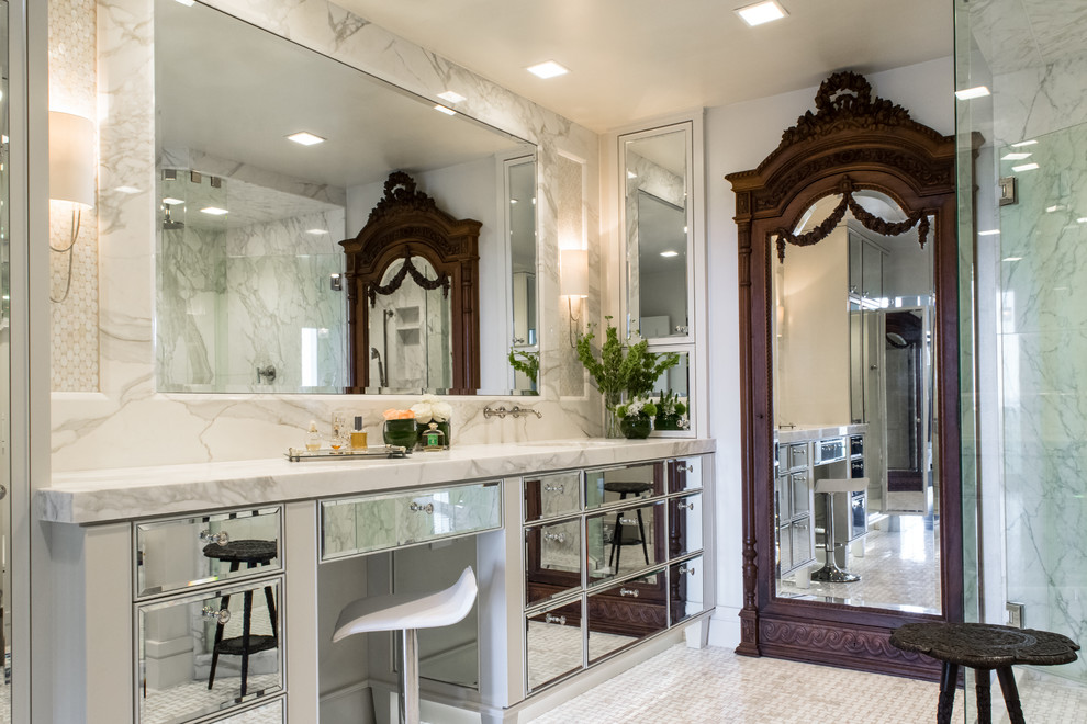 Photo of a transitional master bathroom in Austin with an undermount sink, glass-front cabinets, white cabinets, white tile, white walls and a corner shower.
