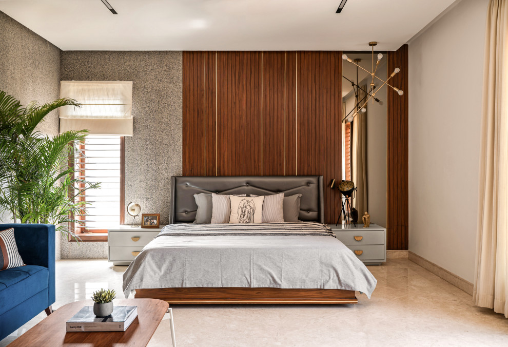 Photo of a contemporary bedroom in Bengaluru with beige walls, beige floor and wood walls.