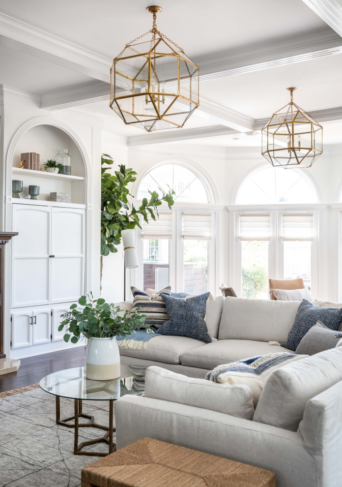 Example of a huge transitional open concept dark wood floor and brown floor family room design in Sacramento with white walls, a standard fireplace, a stone fireplace and a wall-mounted tv