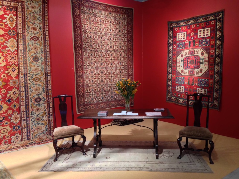 Photo of a large mediterranean study room in San Francisco with red walls, carpet, no fireplace and a freestanding desk.