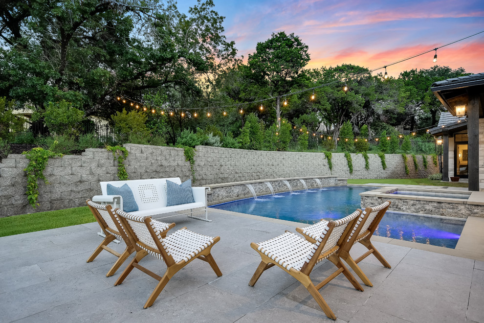 Pool fountain - cottage backyard concrete and l-shaped pool fountain idea in Austin