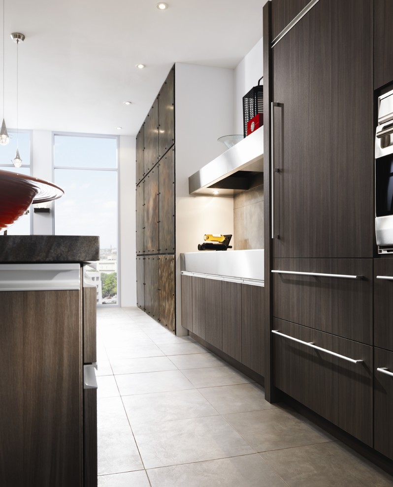 Inspiration for a contemporary kitchen in St Louis with dark wood cabinets and panelled appliances.