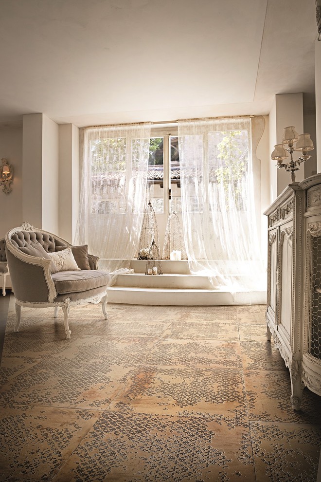 This is an example of a shabby-chic style family room in Bologna with white walls.