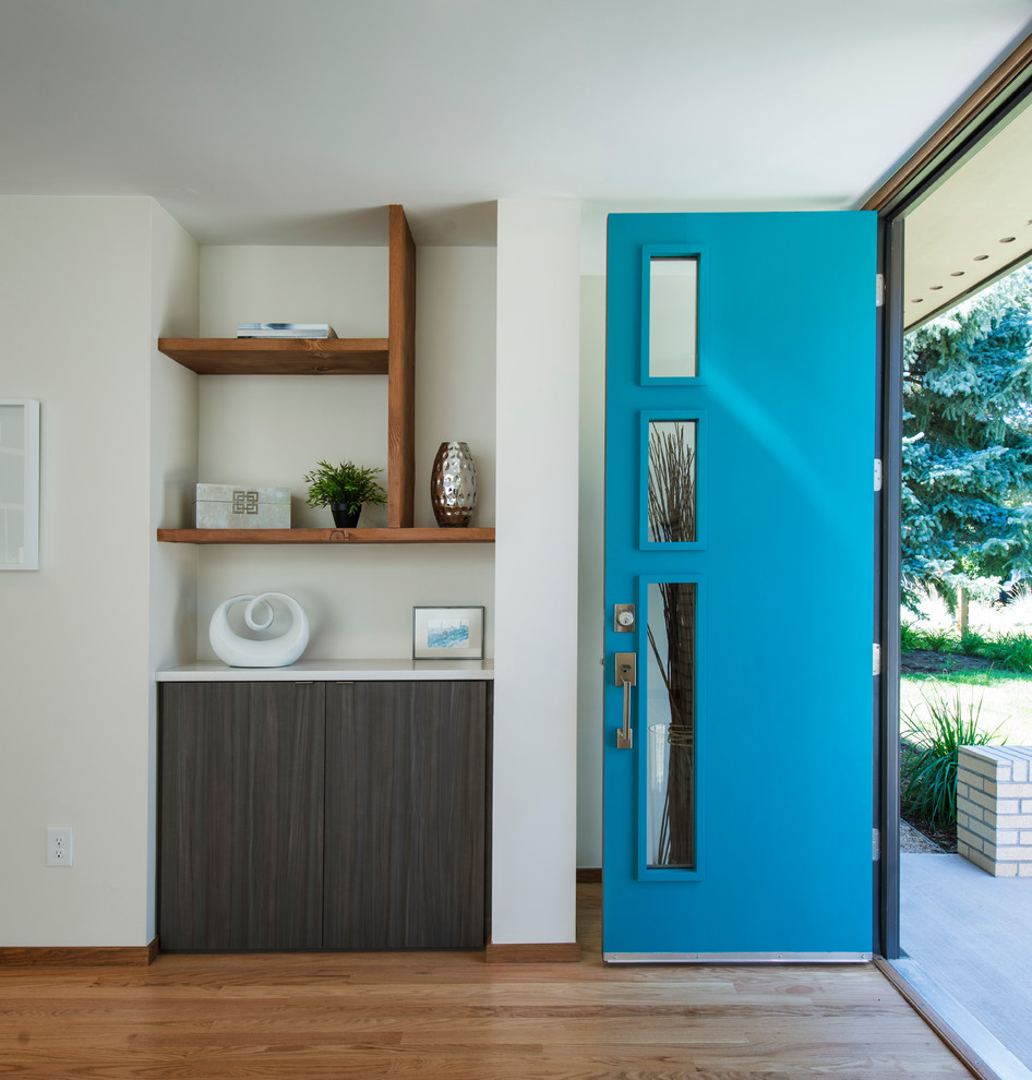 This is an example of a midcentury entryway in Denver.