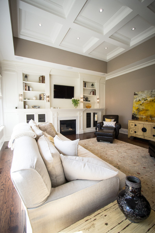 Photo of a transitional open concept family room in Toronto with dark hardwood floors, a standard fireplace and a built-in media wall.