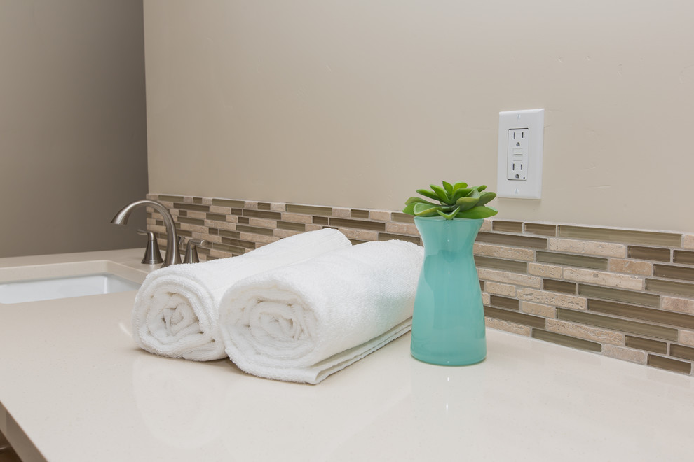 Inspiration for a large contemporary master bathroom in Portland with a drop-in sink, shaker cabinets, medium wood cabinets, quartzite benchtops, a drop-in tub, a double shower, a one-piece toilet, green tile, mosaic tile, white walls and ceramic floors.