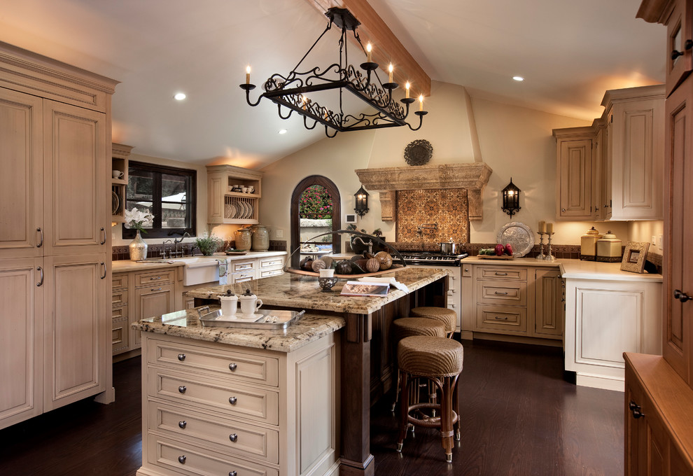 Design ideas for a mediterranean kitchen in Santa Barbara with dark hardwood floors and with island.