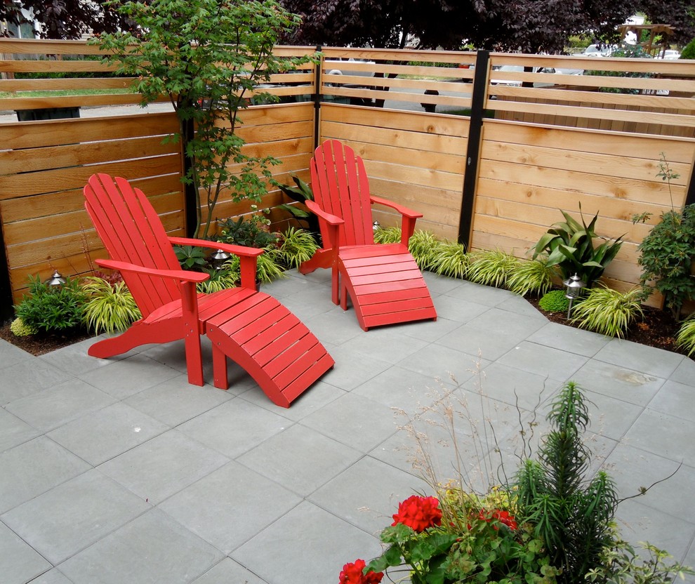 Design ideas for a small modern backyard partial sun outdoor sport court for winter in Seattle with concrete pavers.