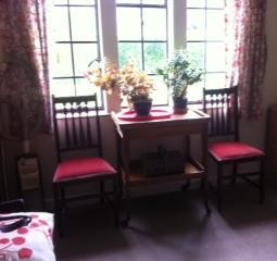 Decluttered reception room used as a storage room